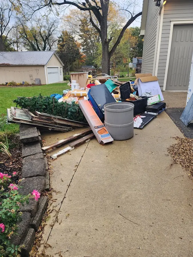 Dumpster being loaded with debris for 3 Yard Dumpster Rental in Emmaus